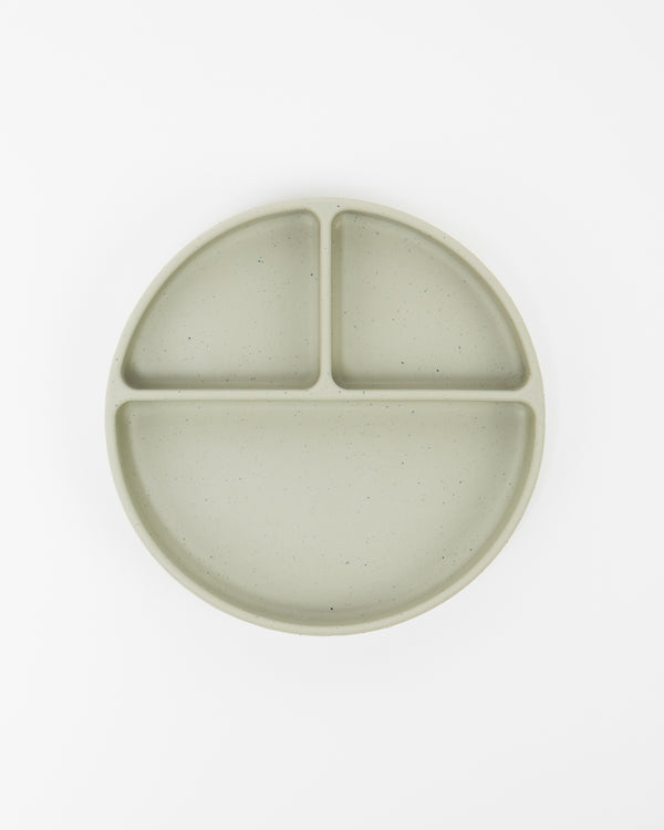 Assiette en silicone compartimentée pour bébé couleur pistache, vue du haut.